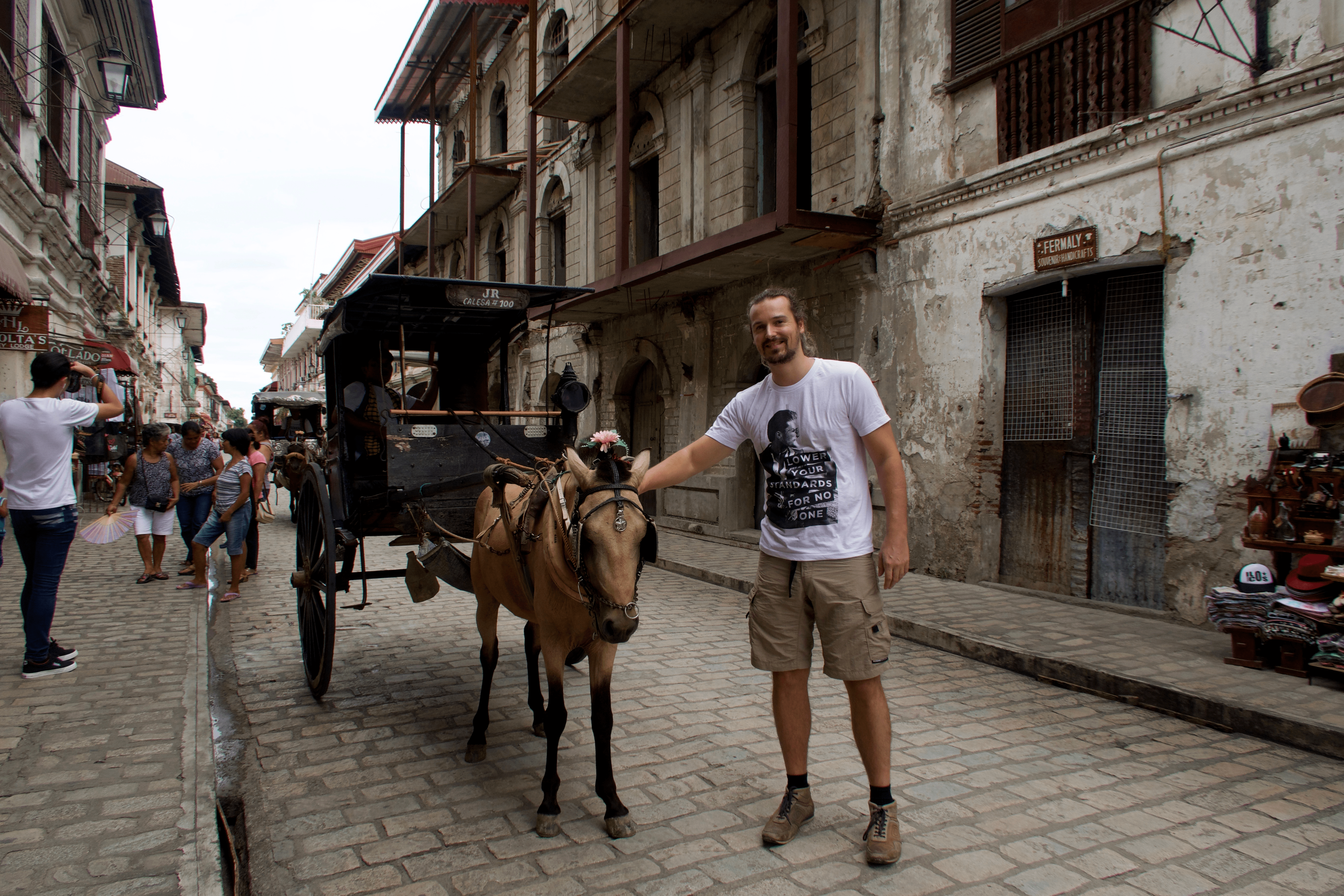 lenny through paradise with a kalesa spanish filipino horse carriage in the calle crisologo famous heritage street in vigan city ilocos sur philippines