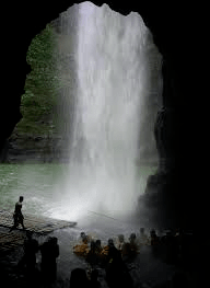 The pagsanjan falls waterfall behind wooden rafts tourists laguna travel philippines