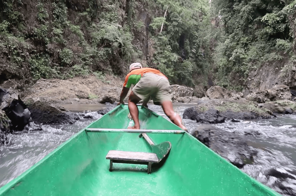 skillful boatmen pulling a boat in cavinti pagsanjan falls laguna philippines