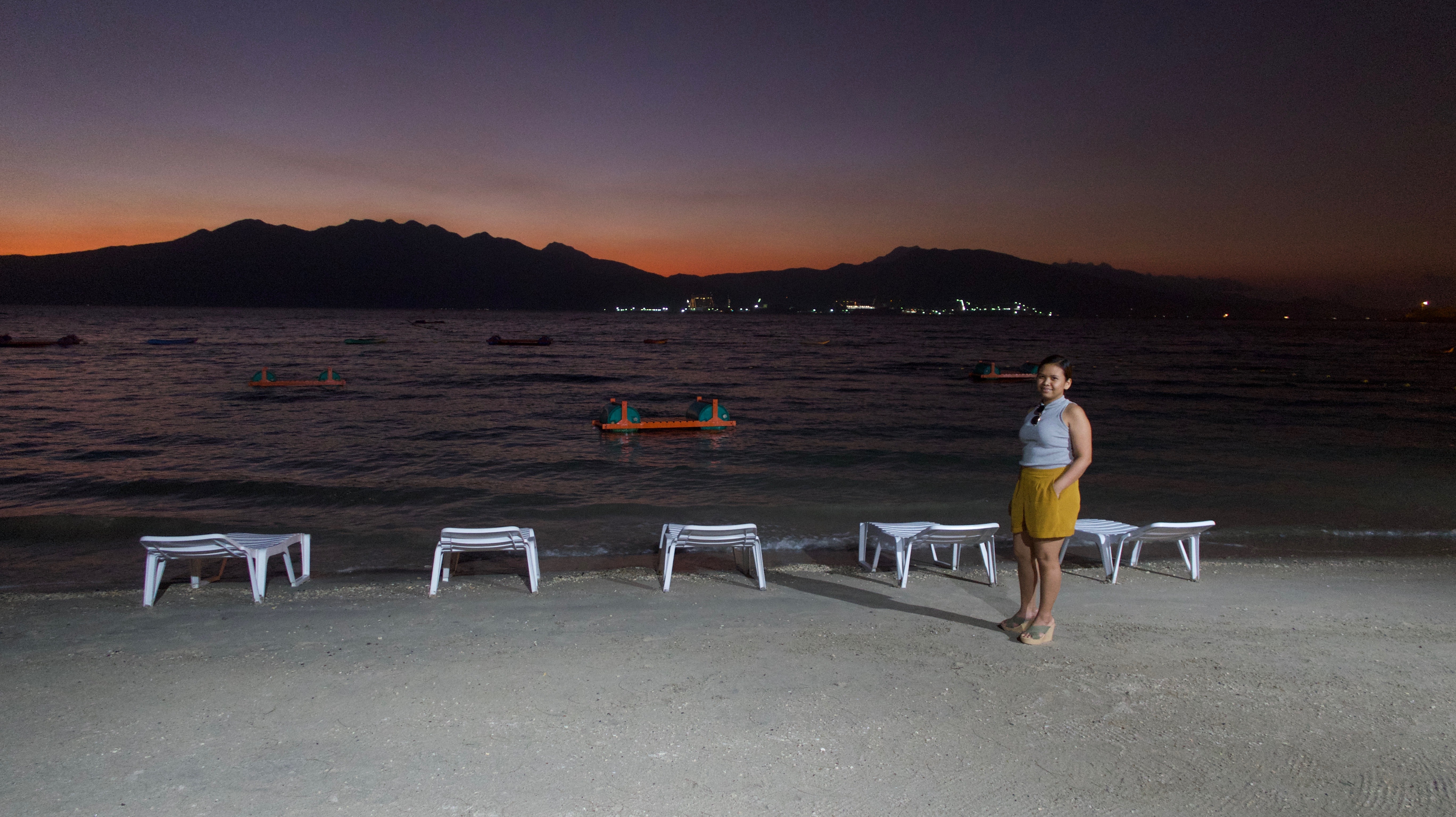 all hands beach sunset view with mountain range