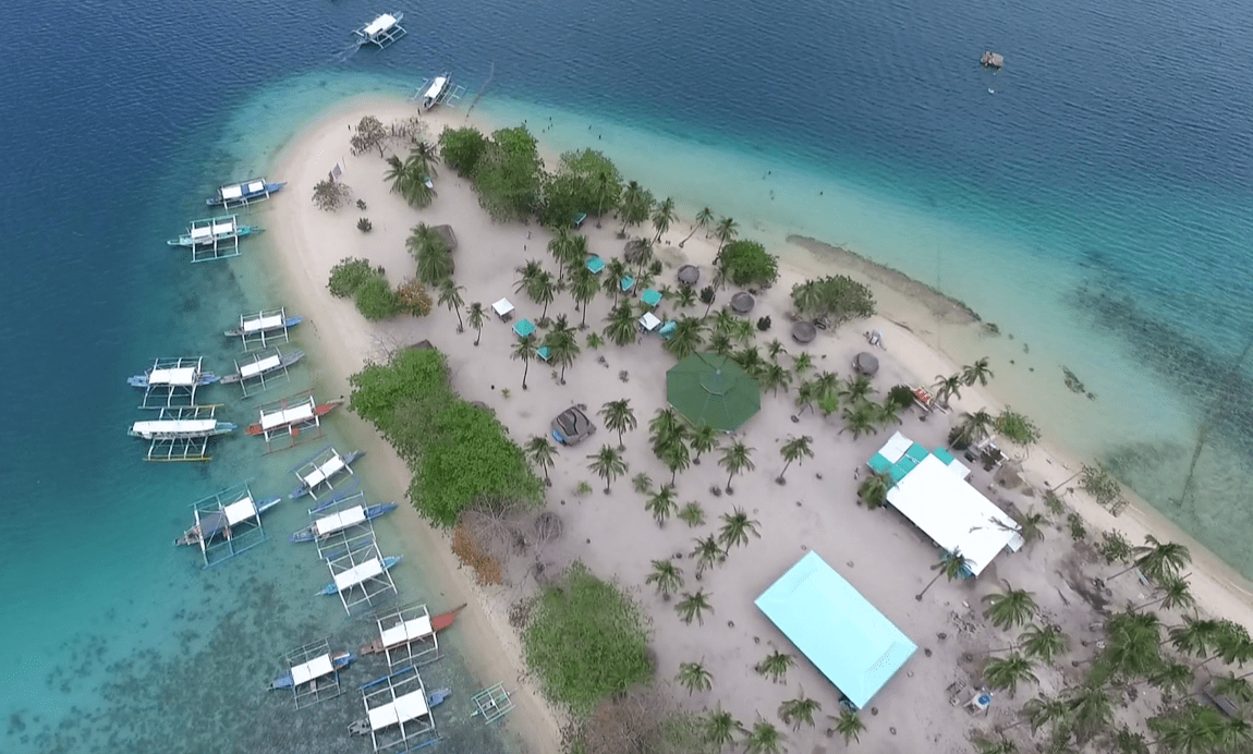 Cowrie island as part of the honda bay tour palawan seen from above