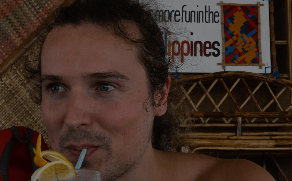 LennyThroughParadise drinks a cocktail at luli island, as part of the honda bay usland hopping tour in palawan