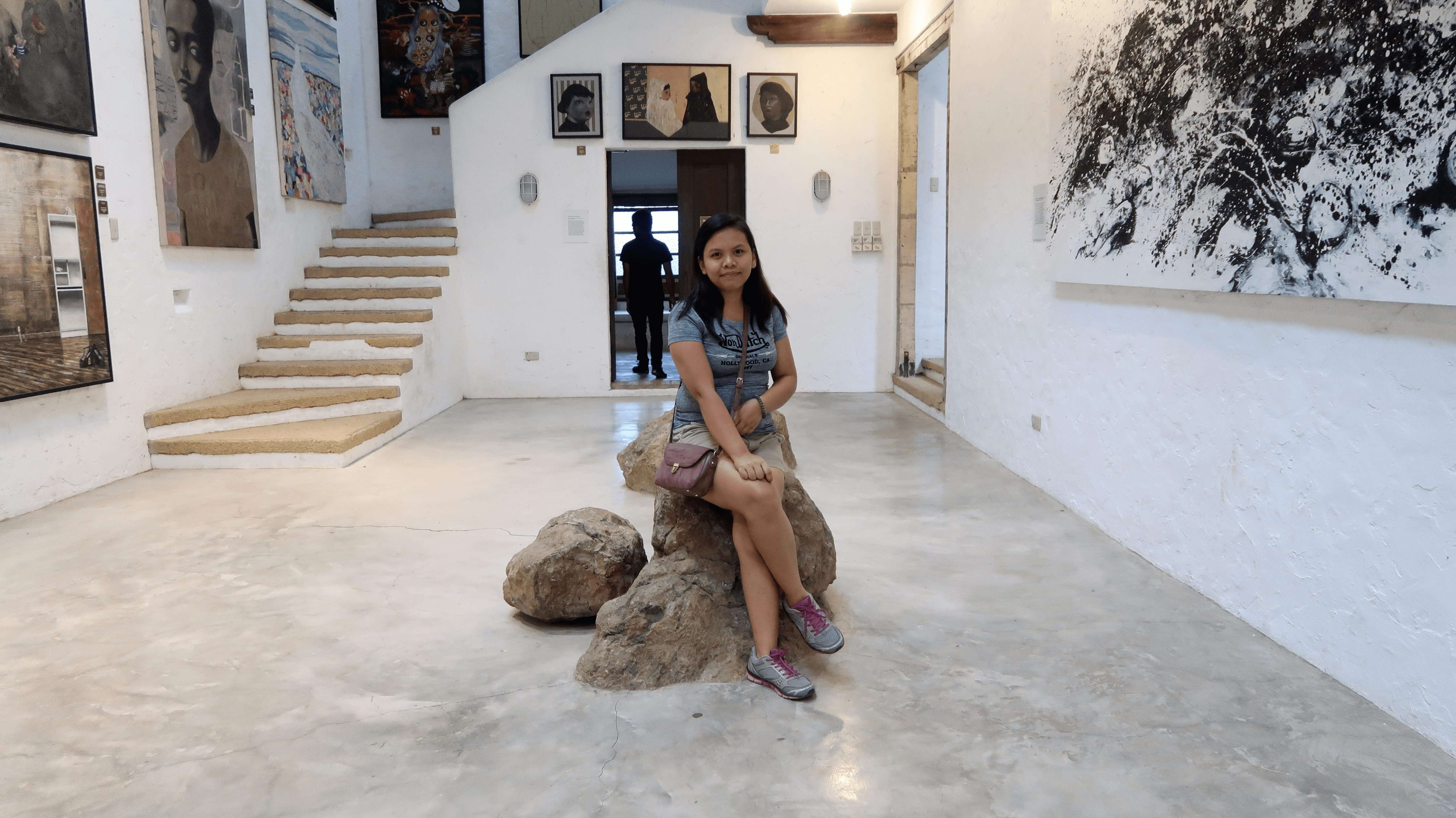 girlfriend sitting in a gallery of pinto art museum