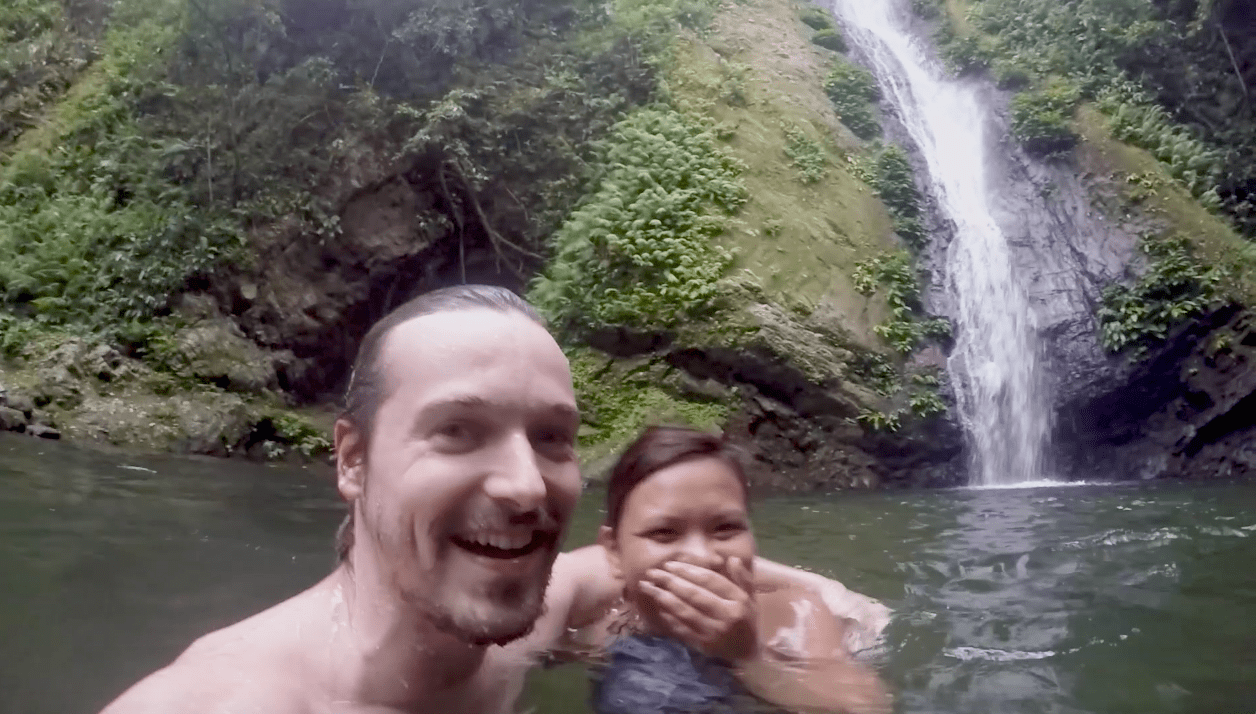 Lenny through paradise and his girlfriend swimming in the kabigan falls waterfall in pagudpud ilocos norte philippines.