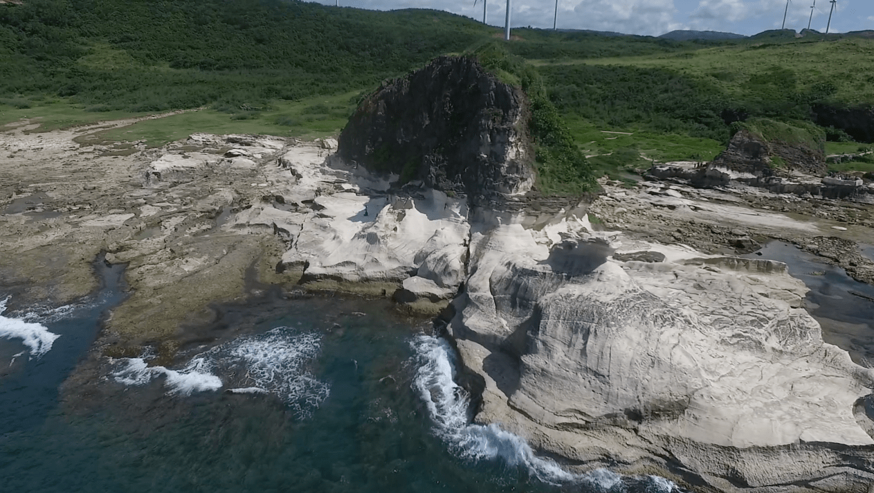 Kapurpurawan rock formation in pagudpud ilocos norte philippines, as seen from the air by drone footage