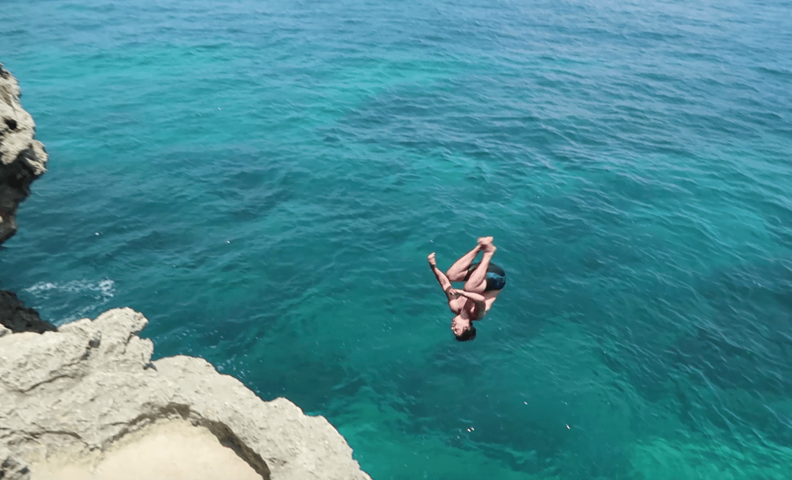 Man cliff diving on fortune island batangas philippines