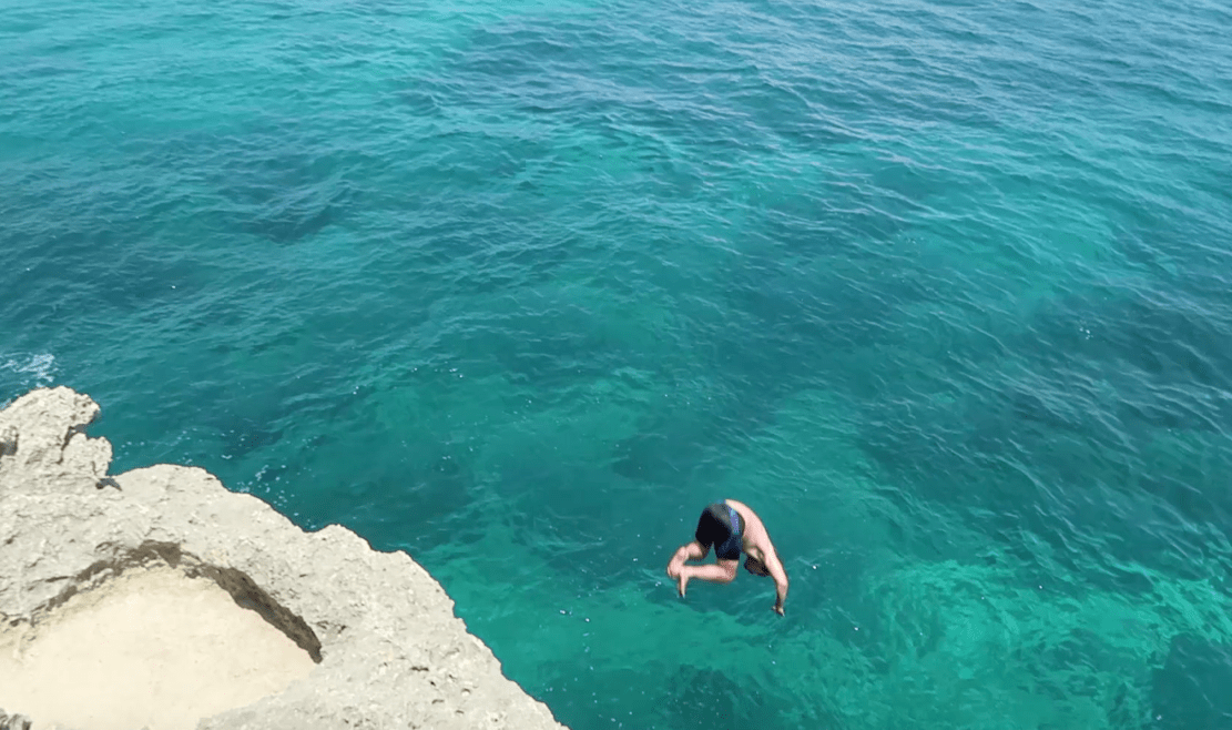 Man cliff diving on fortune island nasugbu philippines