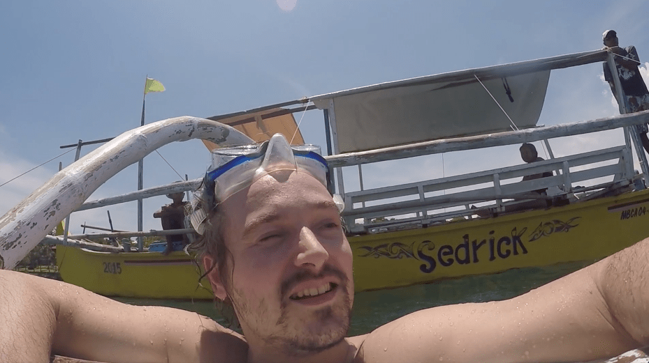 happy man snorkeling in the Philippines