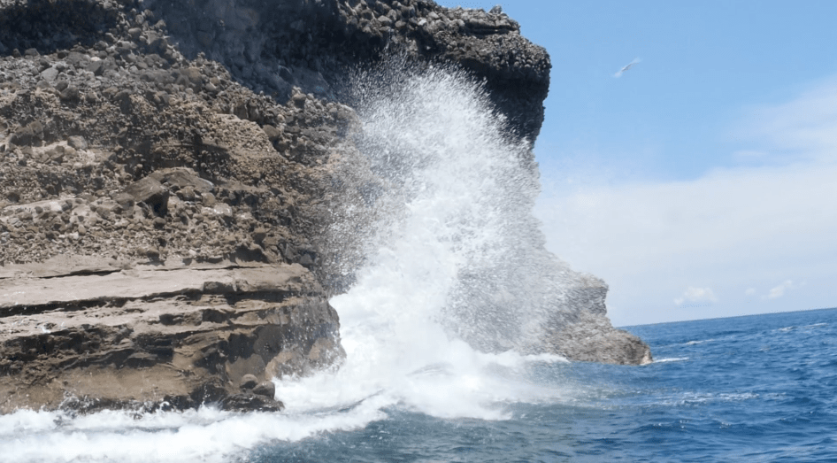 Water splashing against the rocks in the Philippines