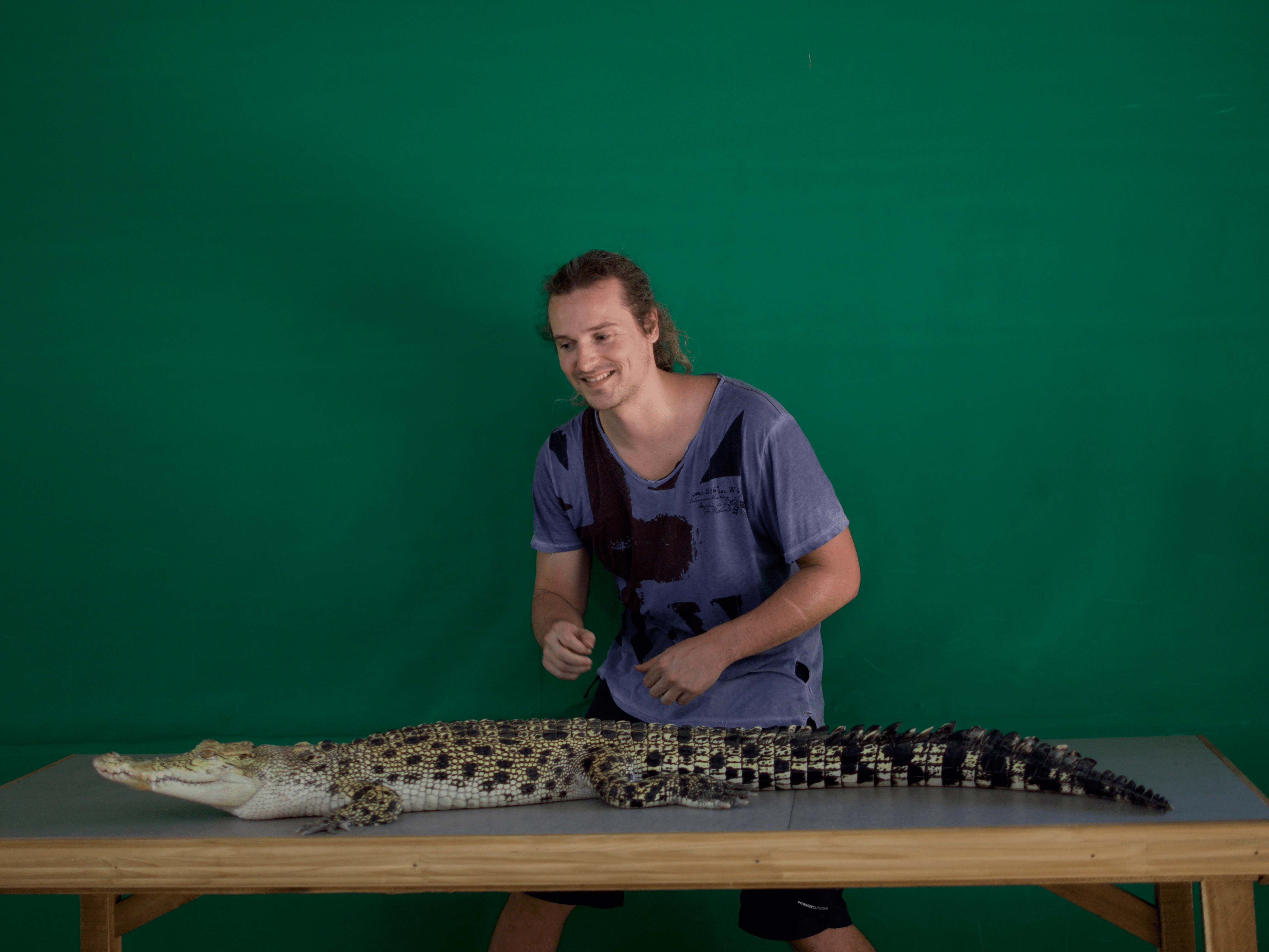 LennyThroughParadise posing with an alligator