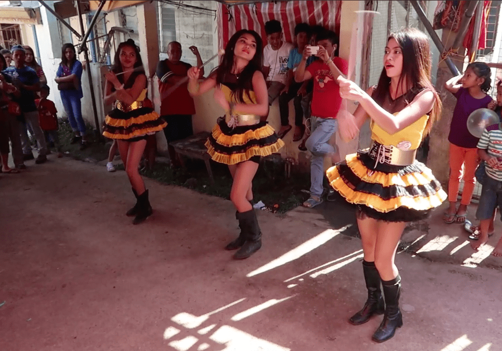 Dancing filipinas at a village fest